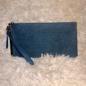 Denim wristlet with gold plate edge detail. NEVER WORN